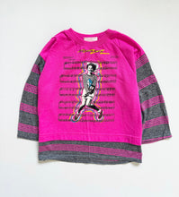 Load image into Gallery viewer, A bright pink long-sleeve sweatshirt with dark gray heathered sleeves and hem, featuring a graphic print of a dancer over sheet music on the front.
